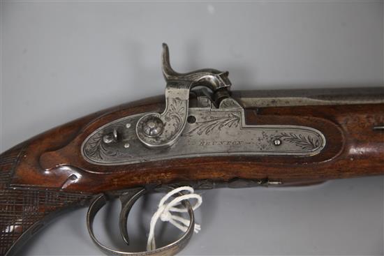 An early 19th century percussion lock holster pistol, signed Brunton, York, 14.75in.